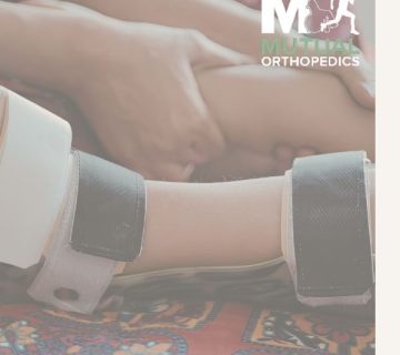 A person fits a prosthetic limb onto another person's leg  The “Mutual Orthopedics” logo is visible in the top right corner 